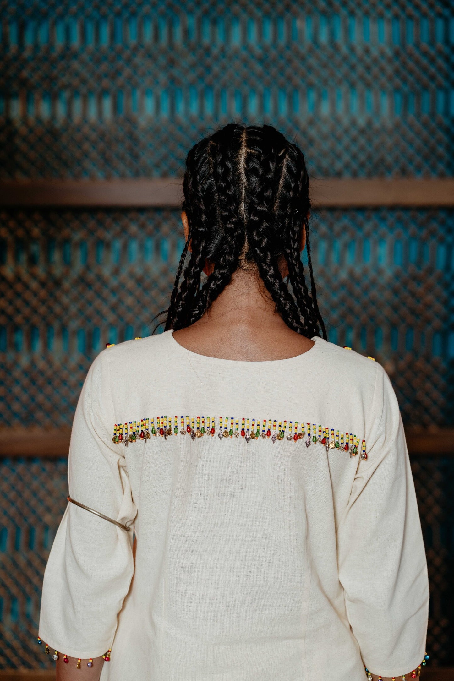 White yellow bead work kurti with same pants