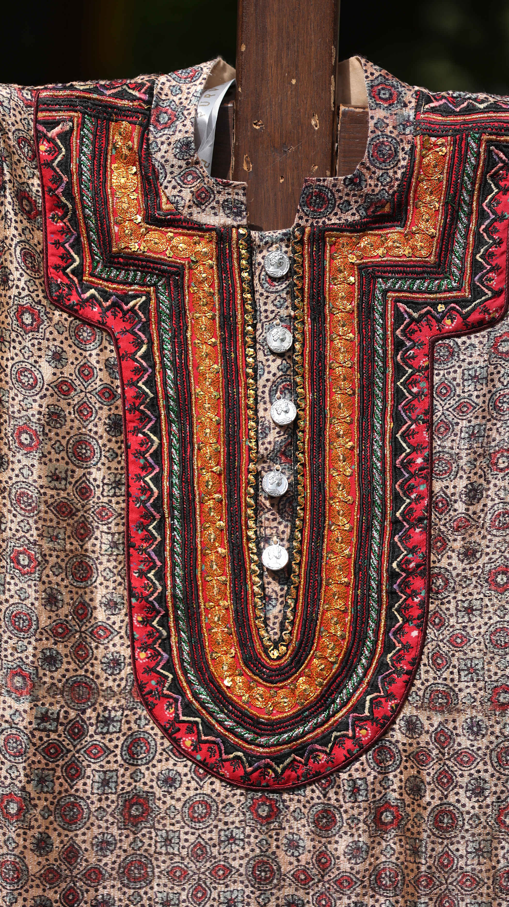 Traditional Red Kurti Set with Intricate Gold Embroidery and Bold Patterning