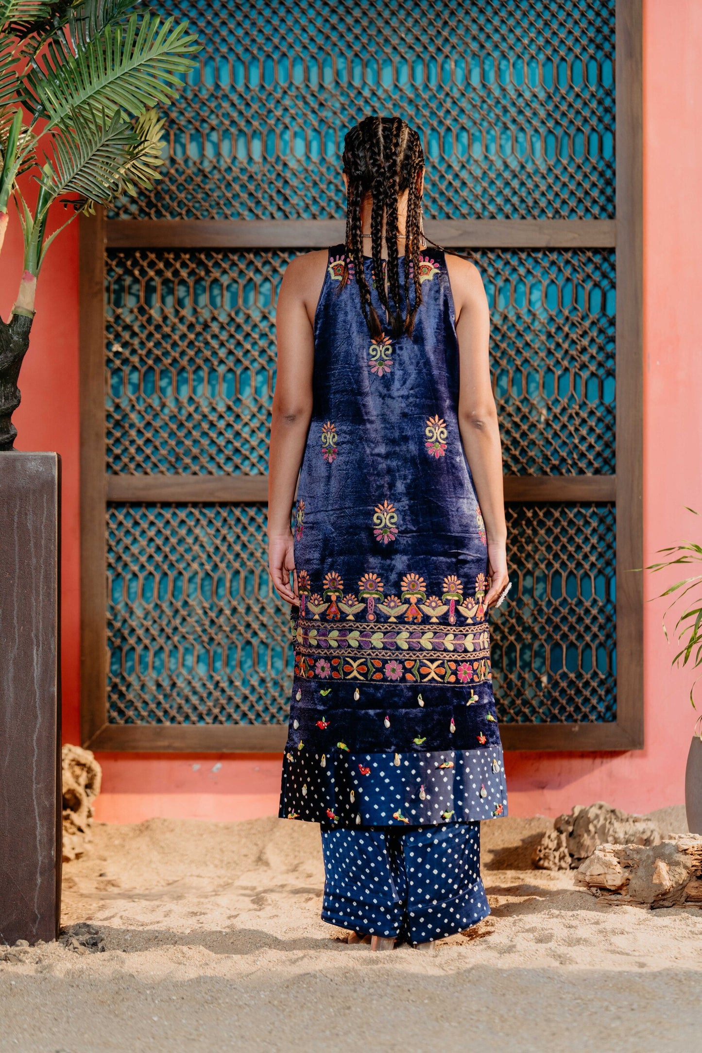 Blue sleeveless mashru fabric handwork kurti with same color bandhej pallazo pant