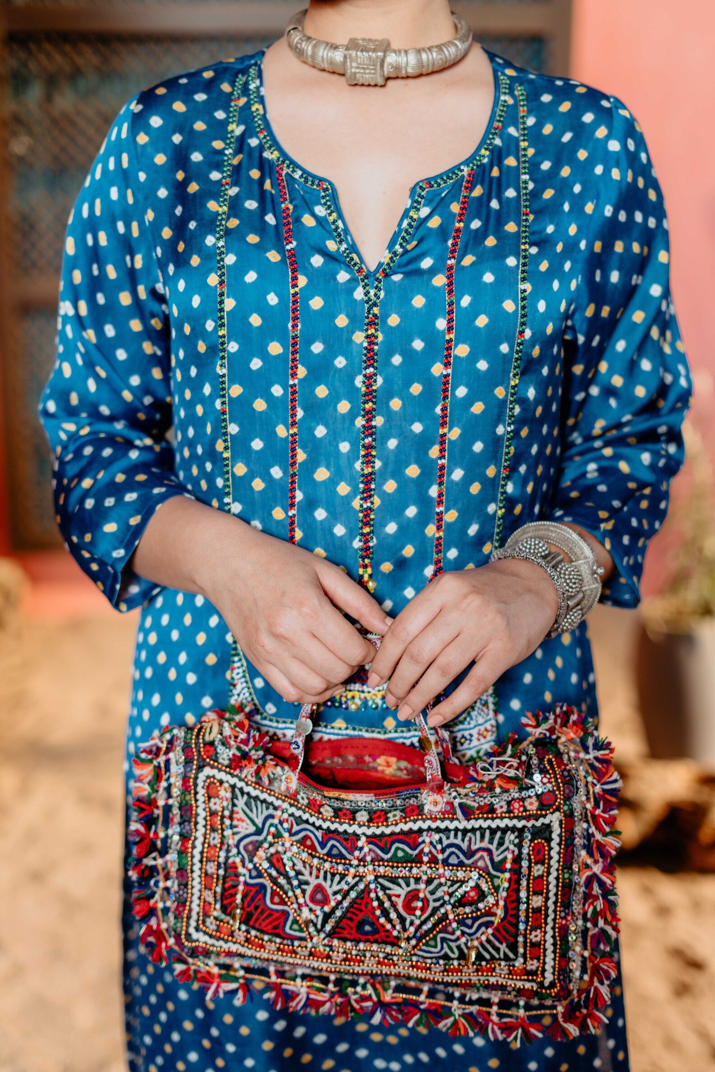Turquoise blue bandhej kurti with square beads work, with white pants