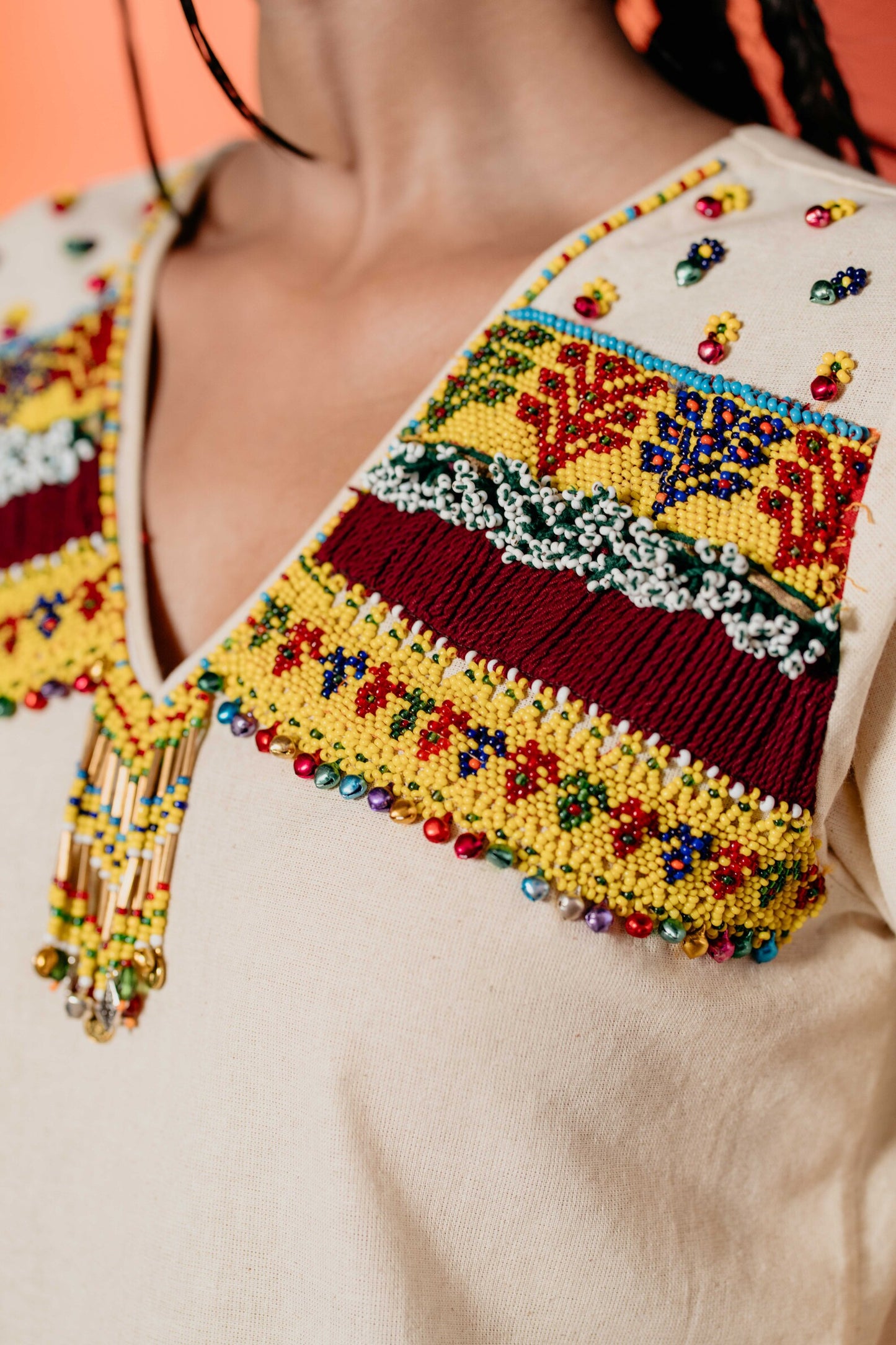 White yellow bead work kurti with same pants