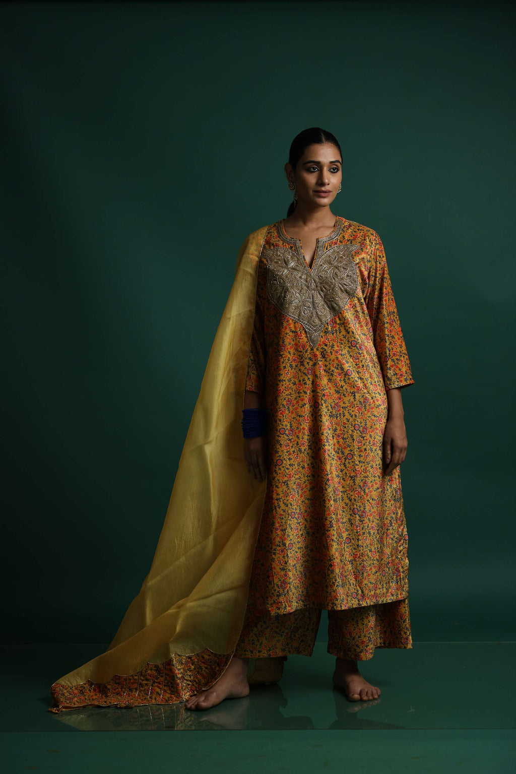 Yellow Kurti Set with Intricate Floral Embroidery and Flowing Fabric