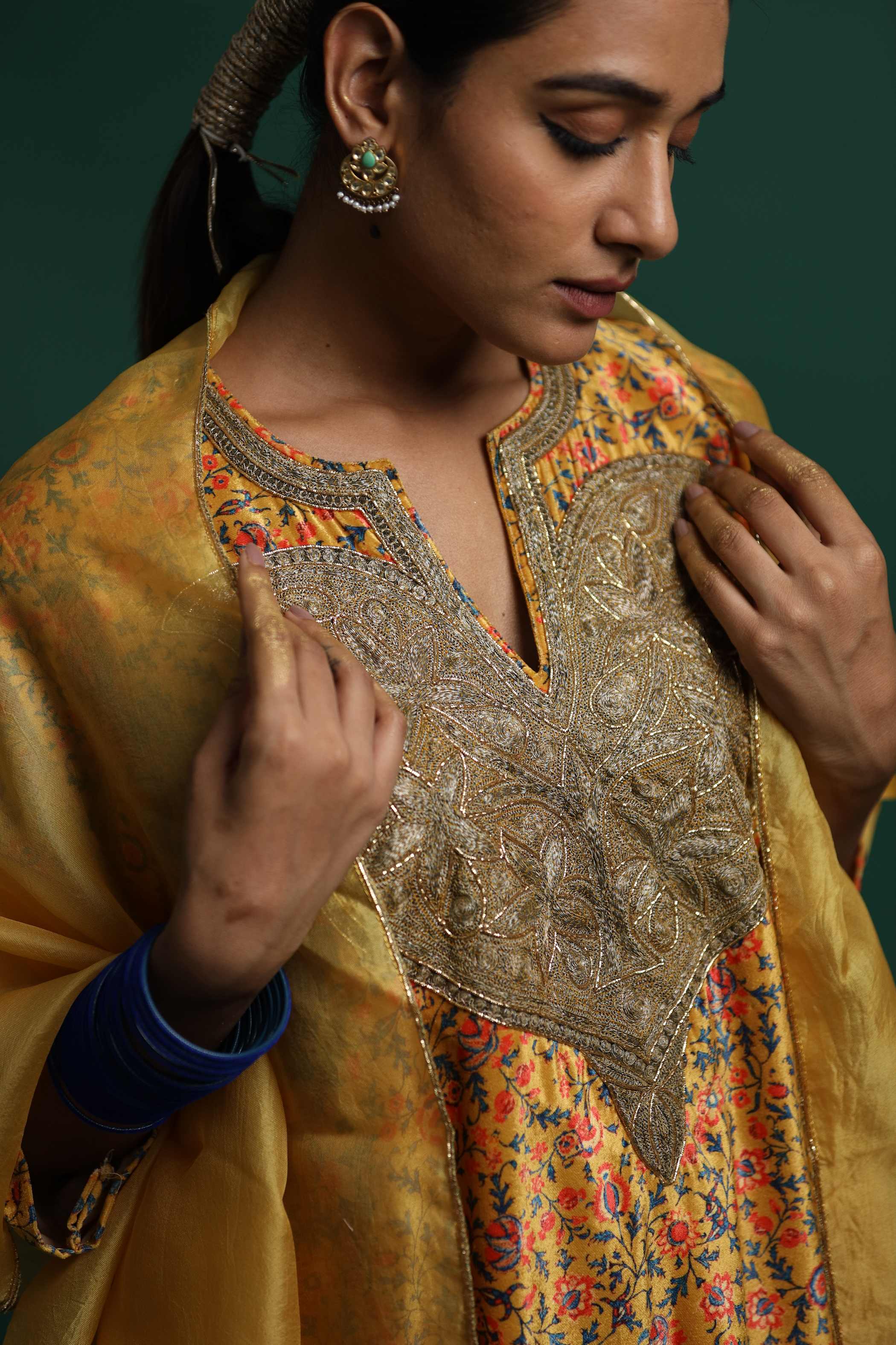 Yellow Kurti Set with Intricate Floral Embroidery and Flowing Fabric