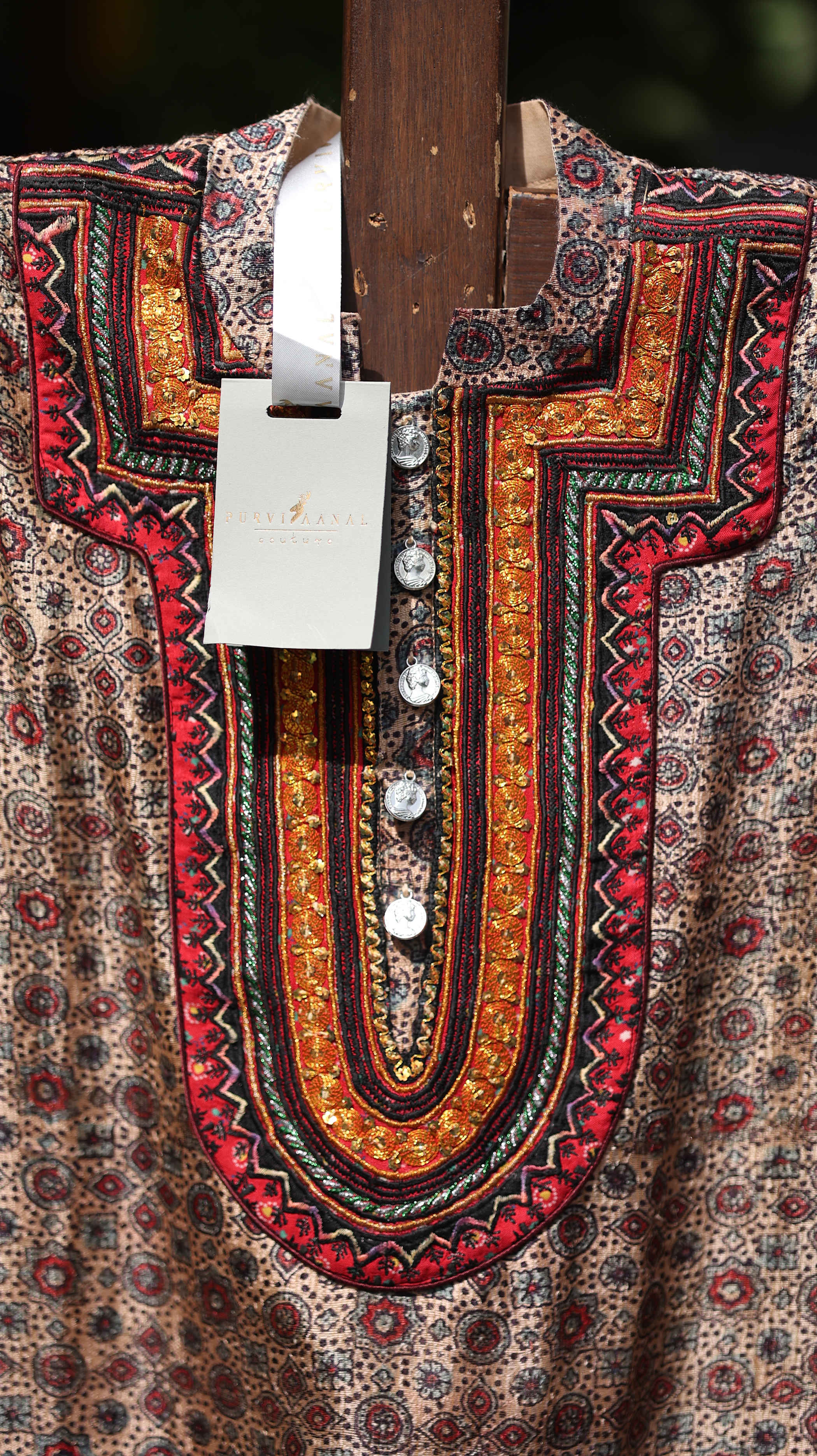 Traditional Red Kurti Set with Intricate Gold Embroidery and Bold Patterning